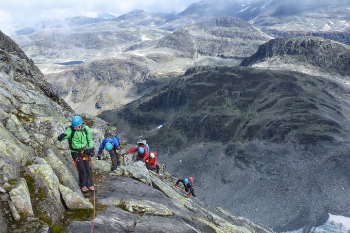 a man standing on top of a mountain