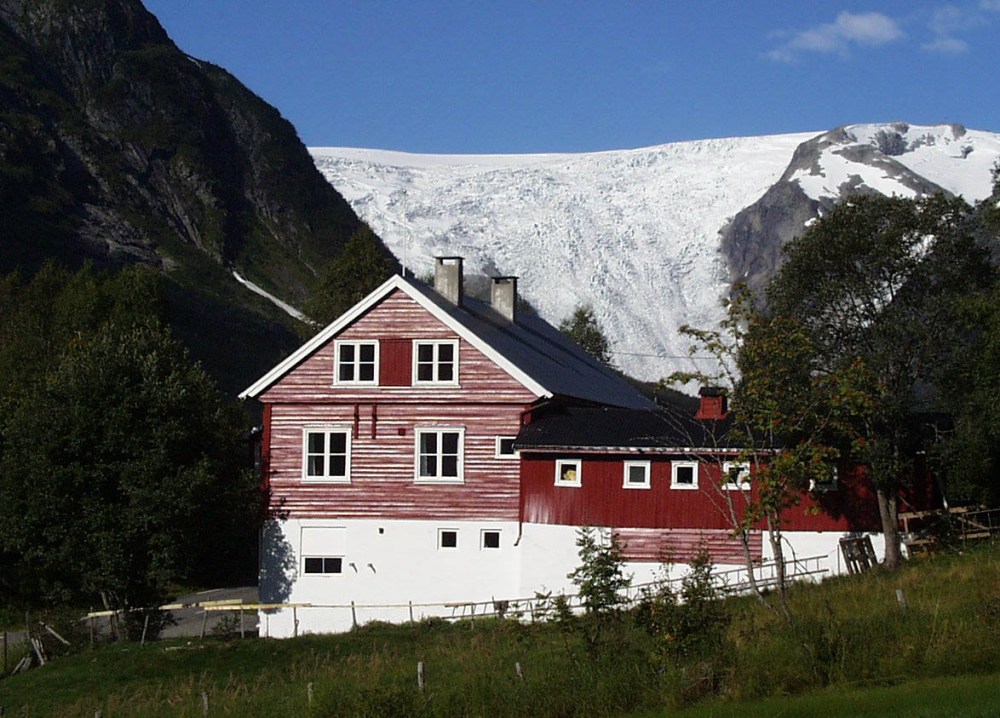 a house with a mountain in the background