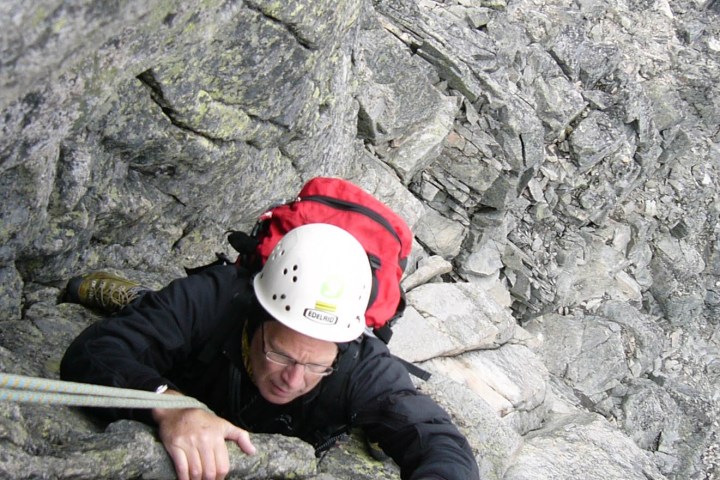 a man riding on top of a rock